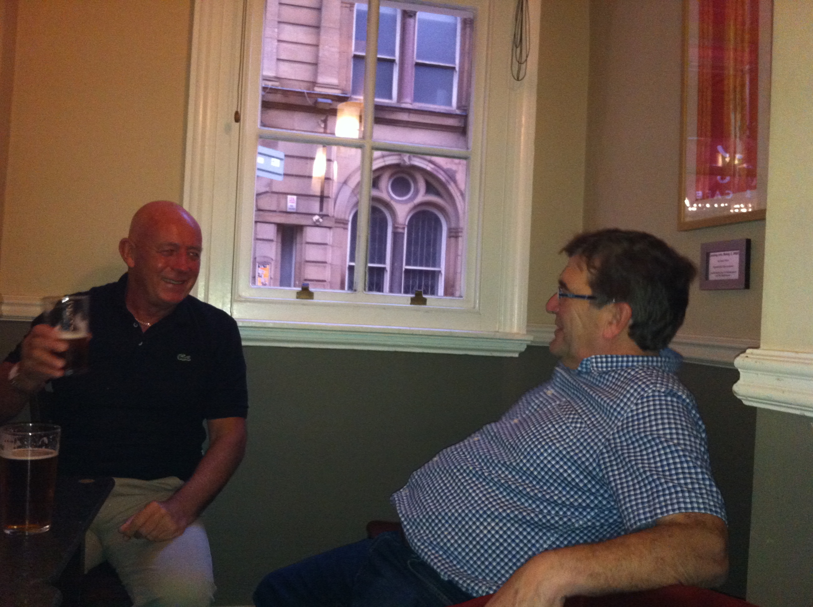 Vinny Collins, deliriously happy at being just back from Barbados, or (more likely) sharing a joke with Stuart Cameron